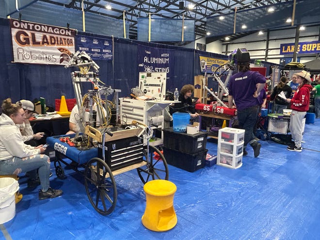Robotics teams put the finishing touches on their machines at the FIRST robotics competition at LSSU on March 24, 2023.