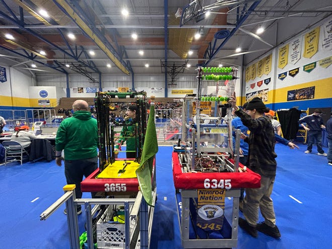 Teams put on their final preparations to begin the competition at the FIRST robotics competition at LSSU on March 24, 2023.