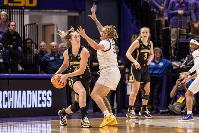 Michigan Wolverines guard Leigha Brown (32) looks to pass the ball against LSU Lady Tigers guard Kateri Poole (55) during the first half at Pete Maravich Assembly Center in Baton Rouge, Louisiana, on Sunday, March 19, 2023.
