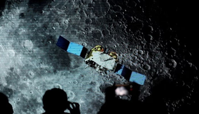 A screen shows footage of spacecraft for the Change-5 Mission, during an event on China’s lunar exploration program, at the National Astronomical Observatories of the Chinese Academy of Sciences (CAS), in Beijing, China. — Reuters/File