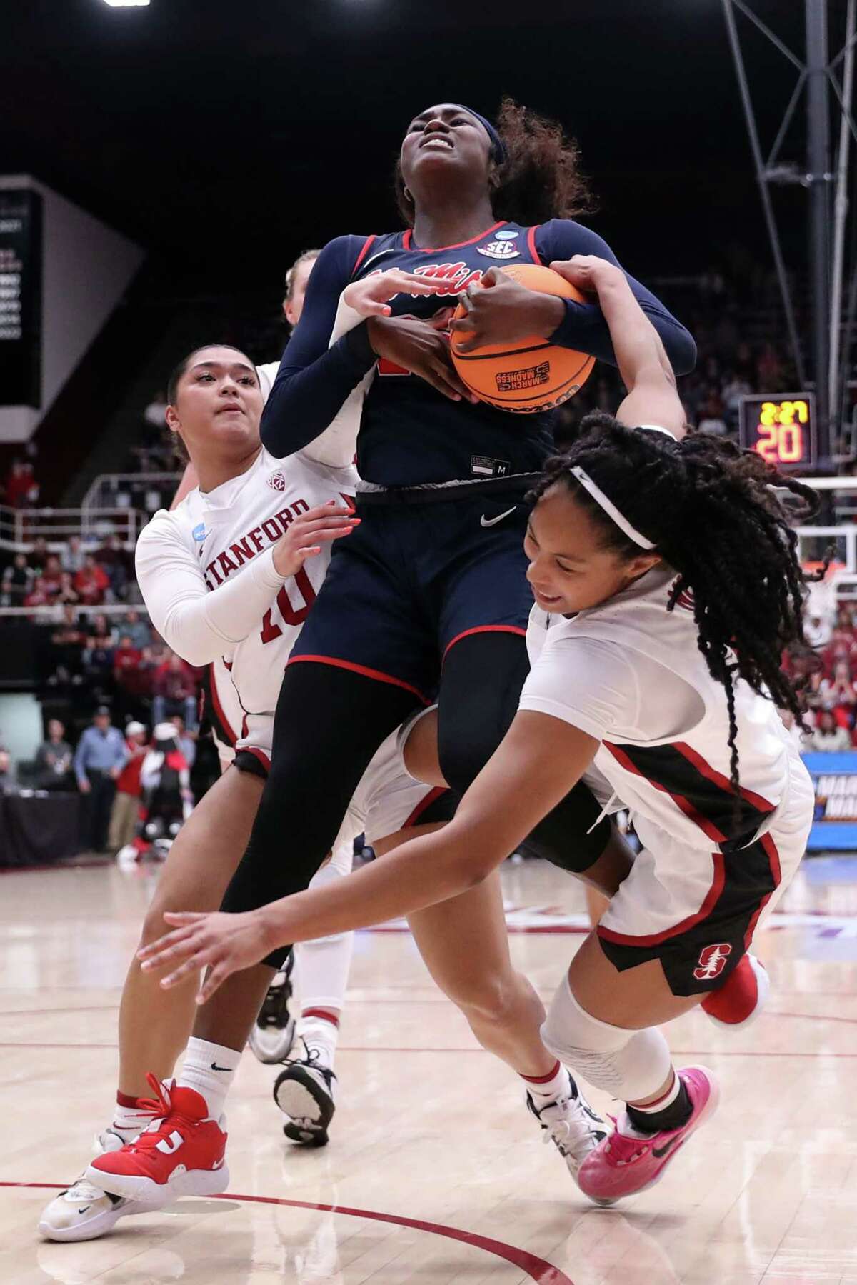 Stanford’s Indya Nivar and Talana Lepolo battle Mississippi’s Tyia Singleton in 3rd quarter during Ole Miss’ 54-49 win in NCAA Division I Women's Basketball Tournament at Maples Pavilion in Stanford, Calif., on Sunday, March 19, 2023.