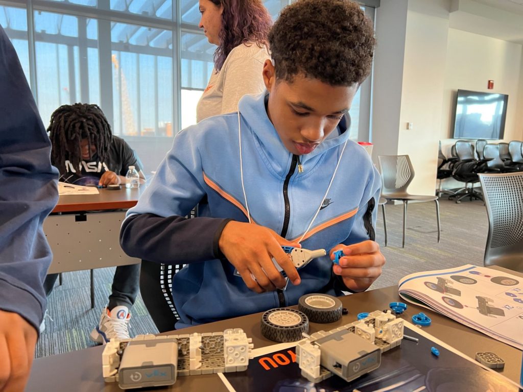 A middle school student builds and programs Vex IQ robots.