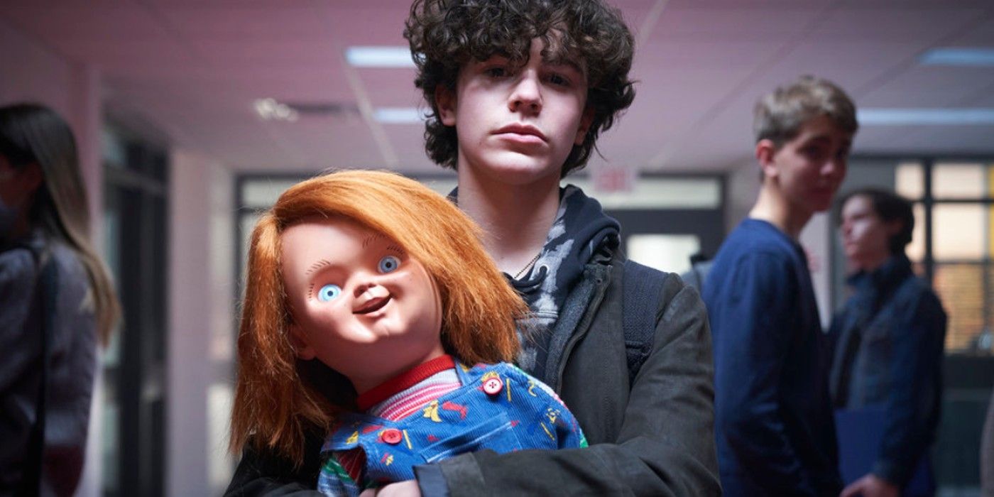Holding the Chucky doll at school in SyFy's Chucky series